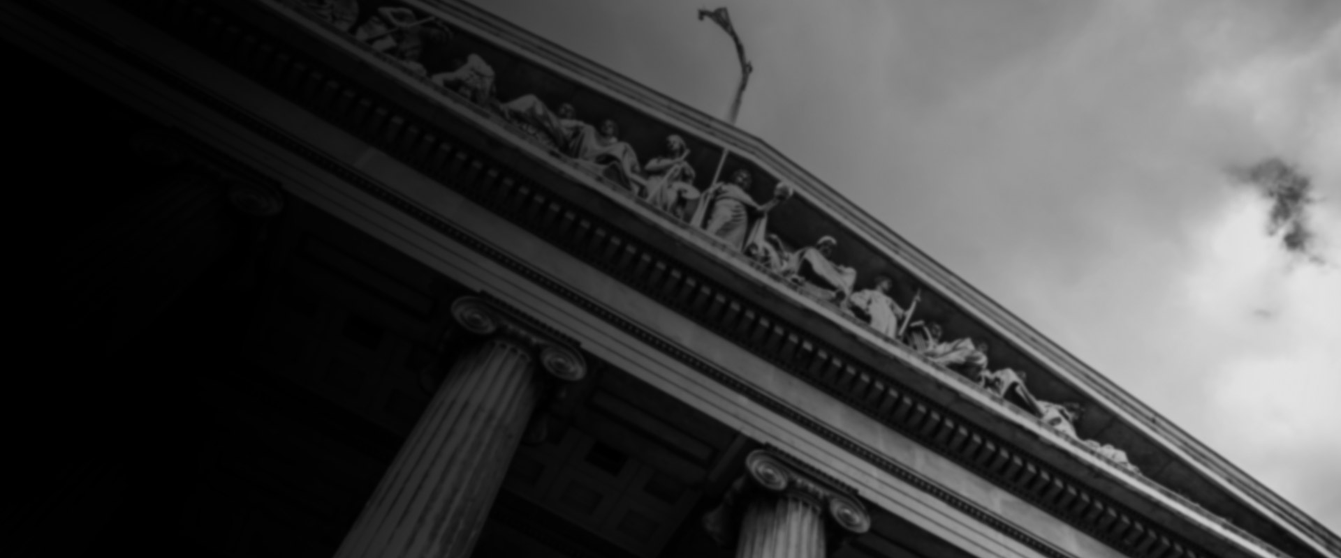 The hero image features the imposing Greek columns of a courthouse, emblematic of Get It Done Law's robust commitment to upholding the law and delivering justice. As a leading legal firm, we stand for integrity, stability, and the unwavering pursuit of our clients' best interests